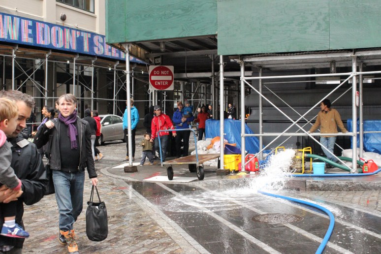 Water being pumped out onto Main Street from Hurricane Sandy's aftermath.