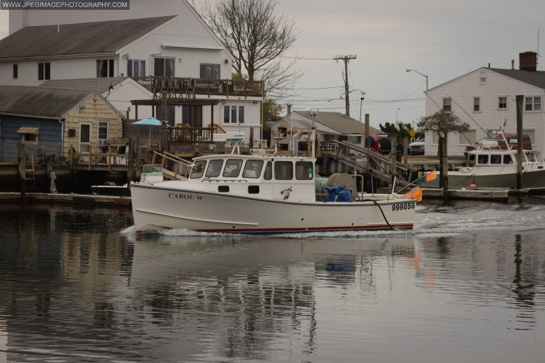 Fishing boat traveling through Nautical Mile.