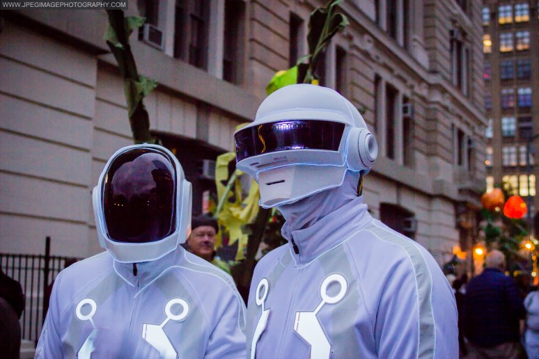 Portrait of two people dressed as the music duo Daft Punk during the New York City Halloween parade.